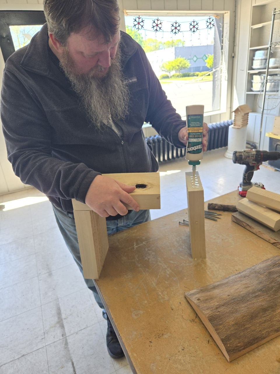 Gluing part of the rustic bee hotel outer box together