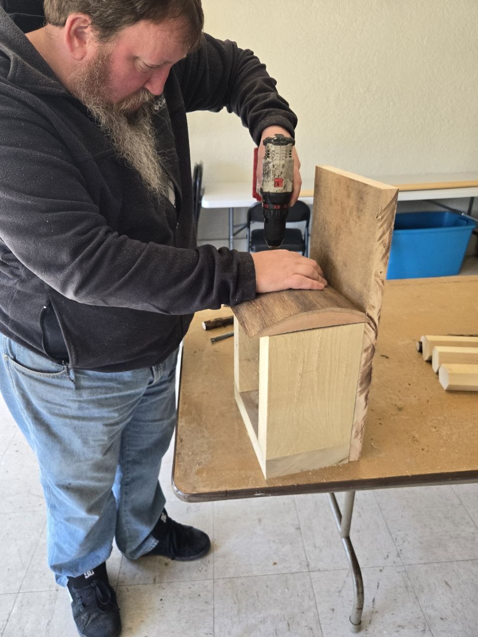 Adding glue while shaping the rustic bee hotel frame