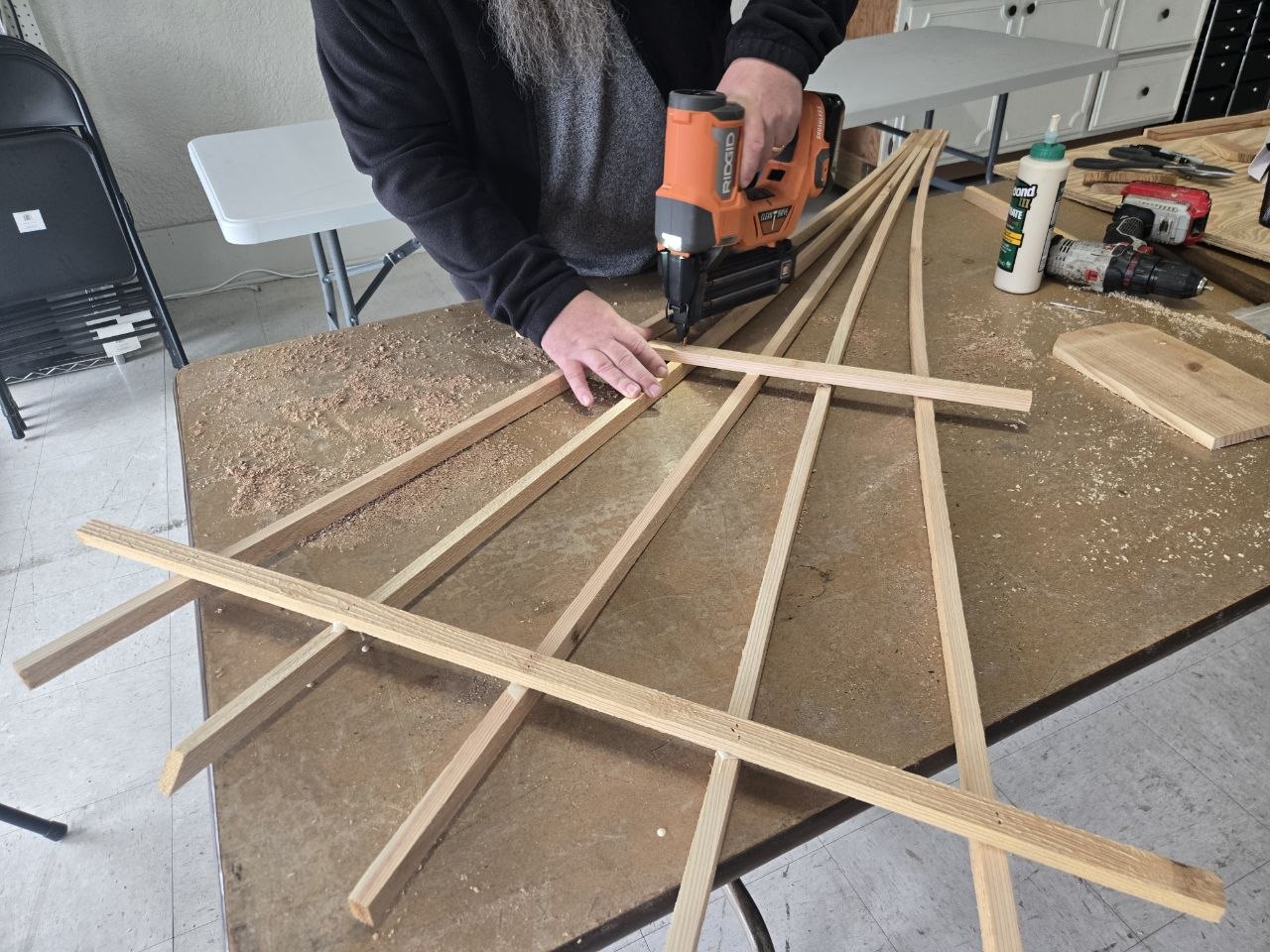 Adding the lower fan spreaders to the cedar berry trellis while keeping them above the strengthened base section