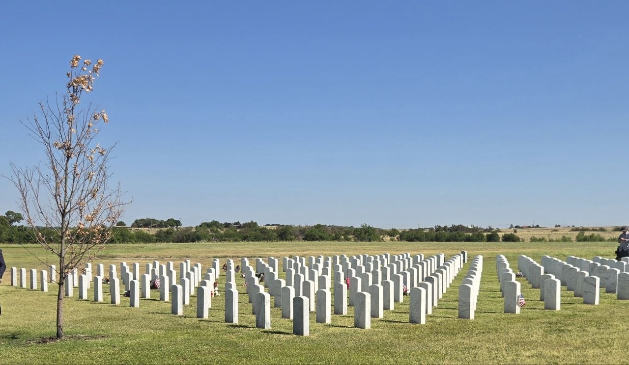 Rows of headstones at the cemetery during the Oklahoma funeral trip