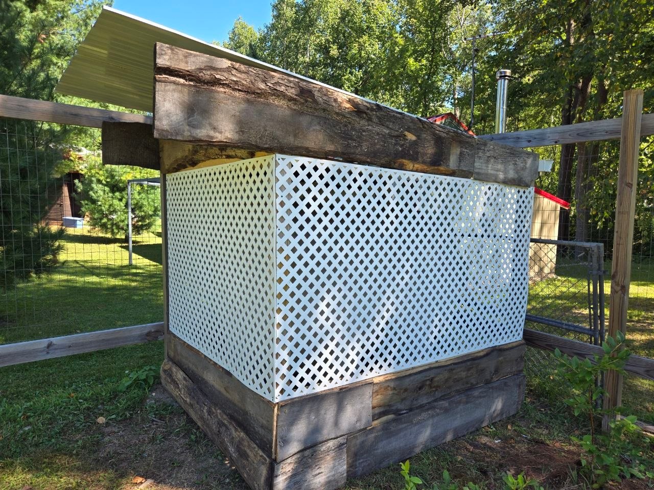 Decorative structure built around the new 500 gallon tank after it was raised up on blocks at the cabin