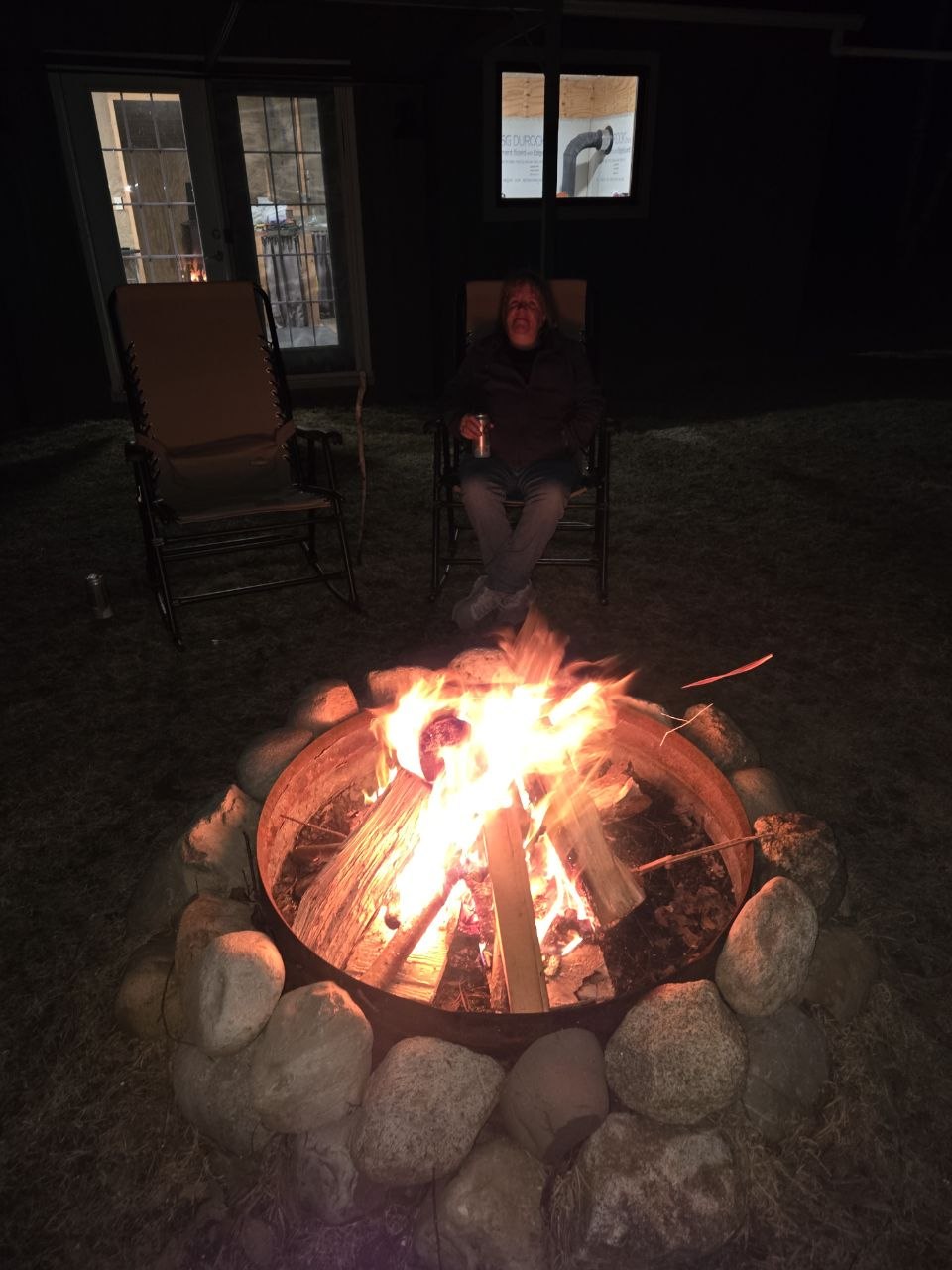 Nighttime bonfire outside the cabin as the 2025 season began to open up