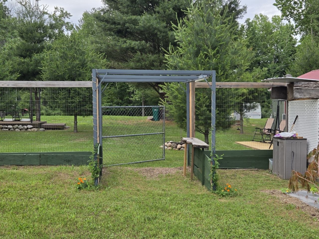 The weird swing structure at the garden opening before it may someday become a grand entrance