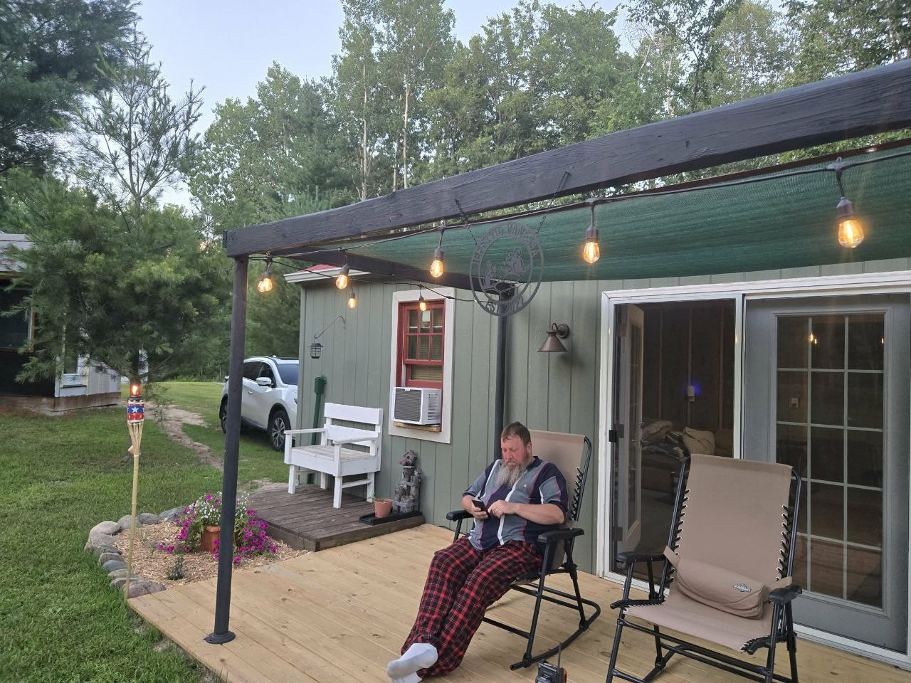 Evening deck scene with party lights strung up during the hot summer stretch of 2025
