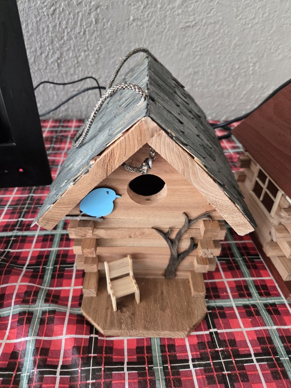 Whimsical birdhouse project completed during the long Michigan winter before the 2026 cabin season