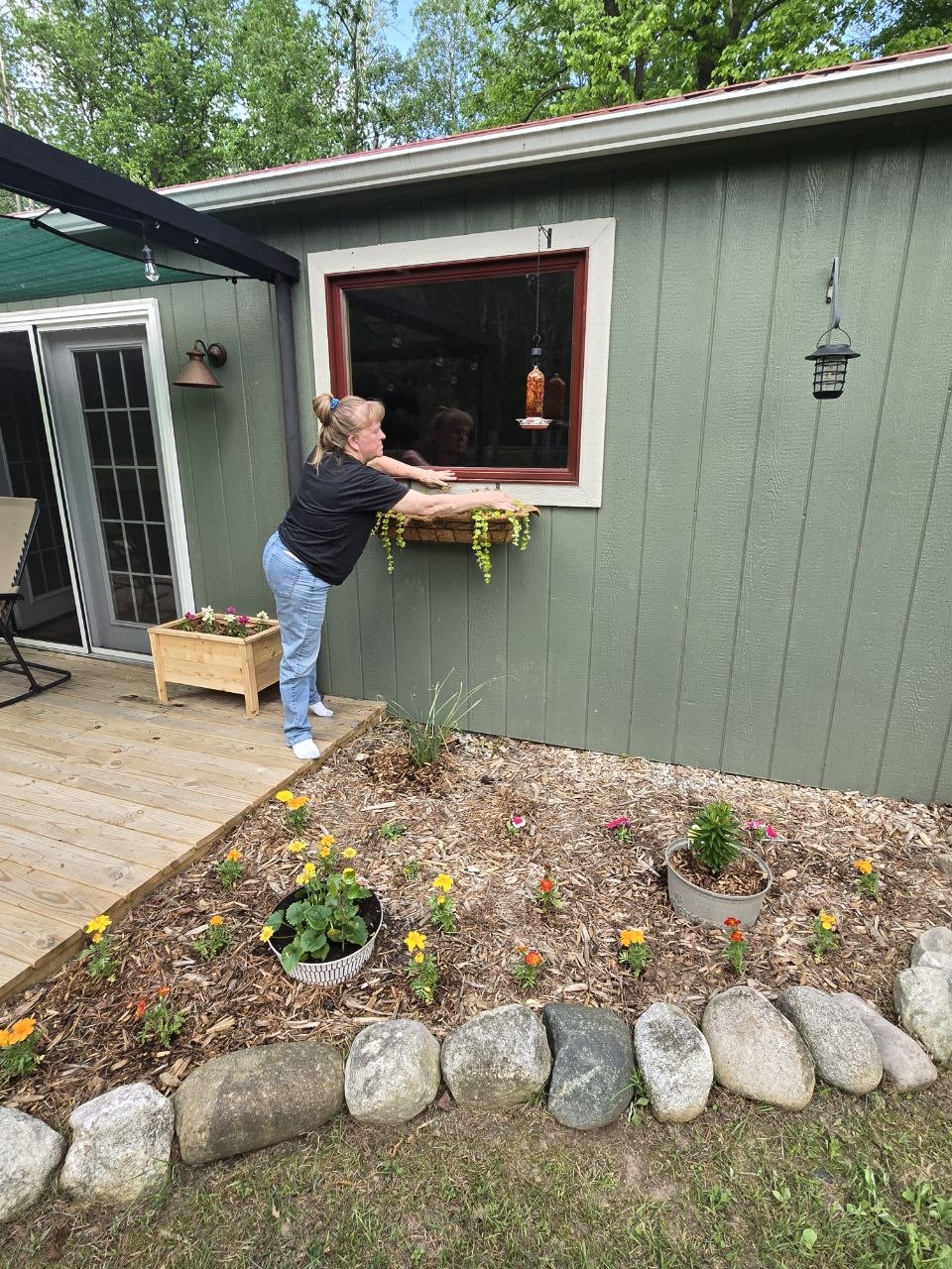 Fresh flowers and cabin deck area looking more alive again during the late May 2026 trip