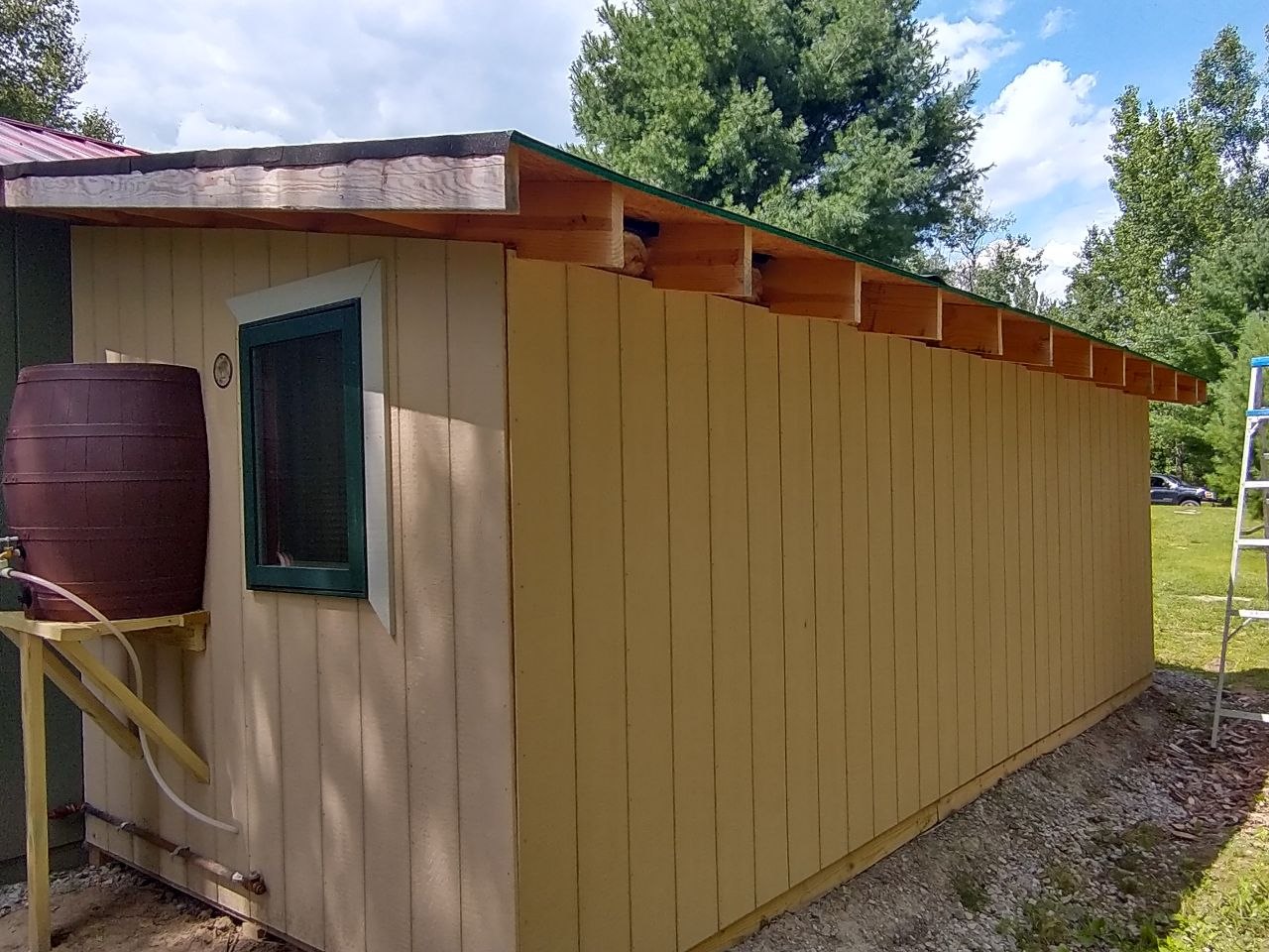 First crude outdoor barrel wash-up setup beside the bathroom structure