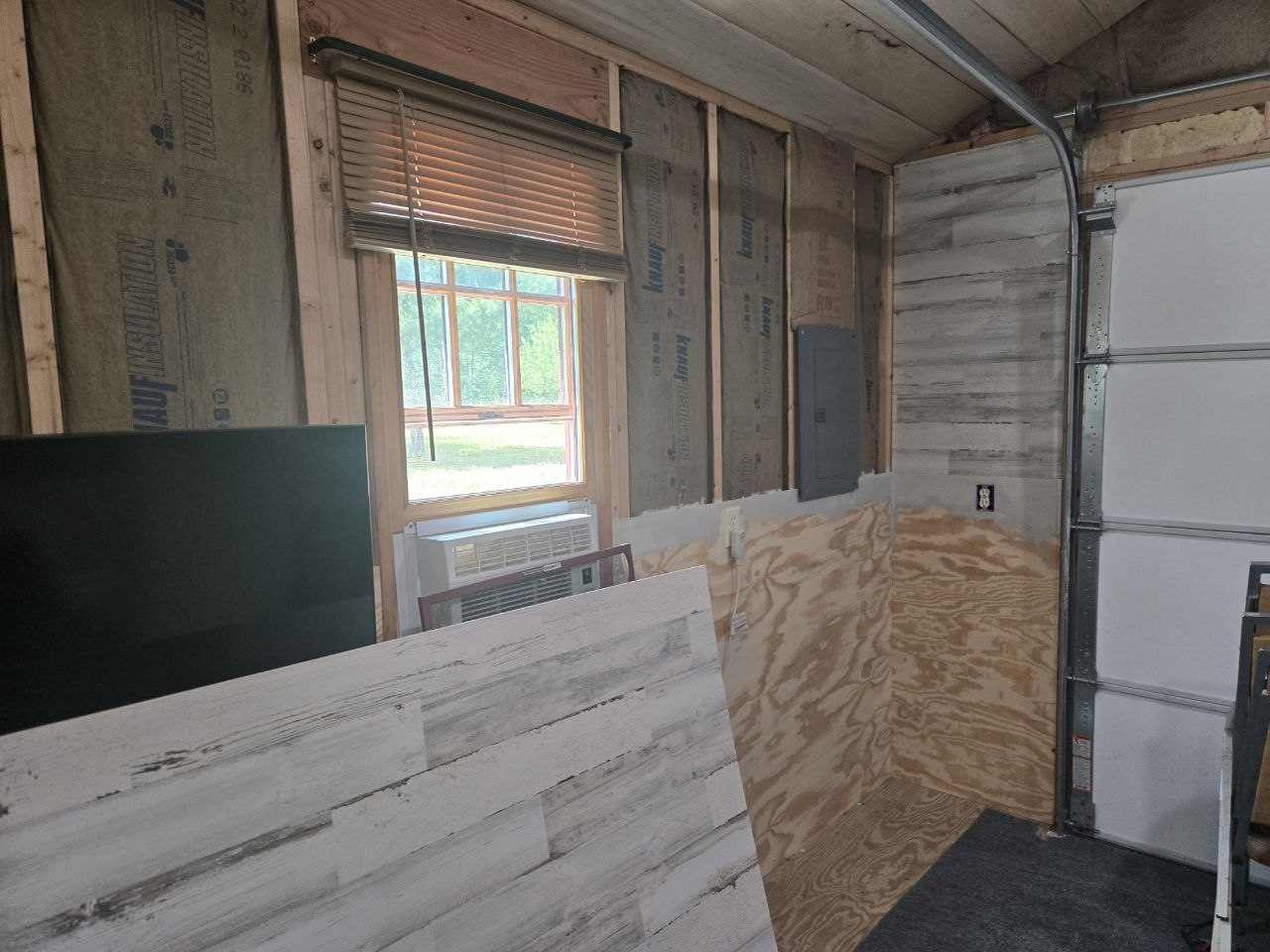 Decorative upper wall paneling going up inside the cabin during the June 2026 wall project